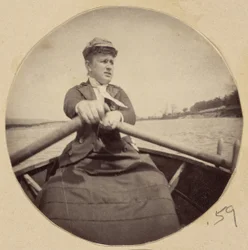 Woman in Hat Rowing a Boat